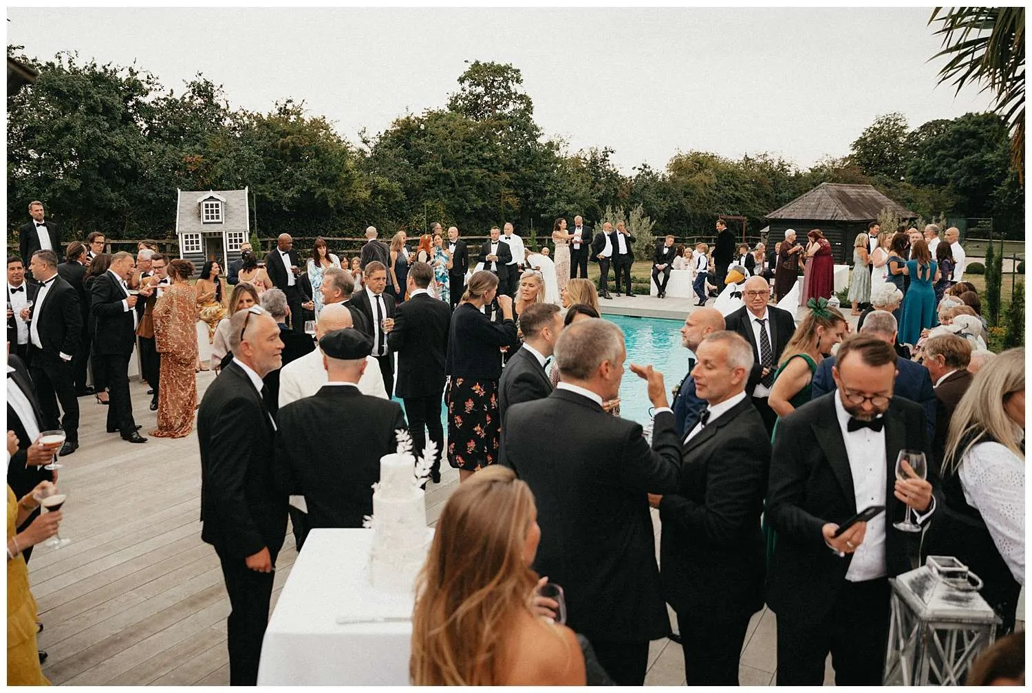 Colchester Wedding Photography - guests mingling by the pool