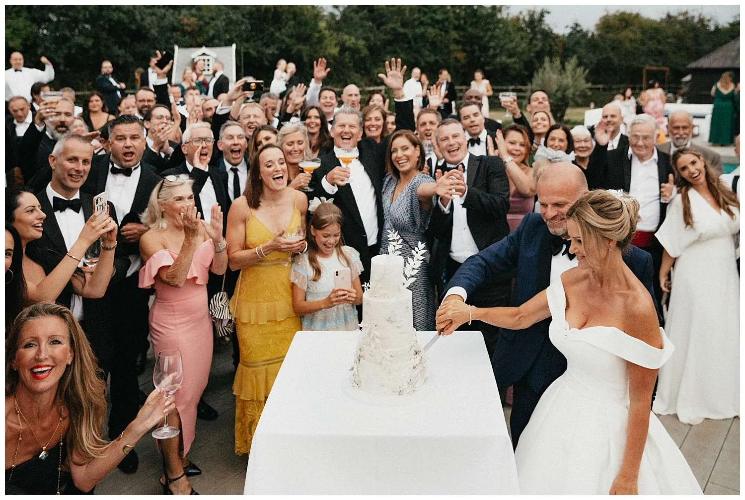 Colchester Wedding Photography - bride and groom cut the cake