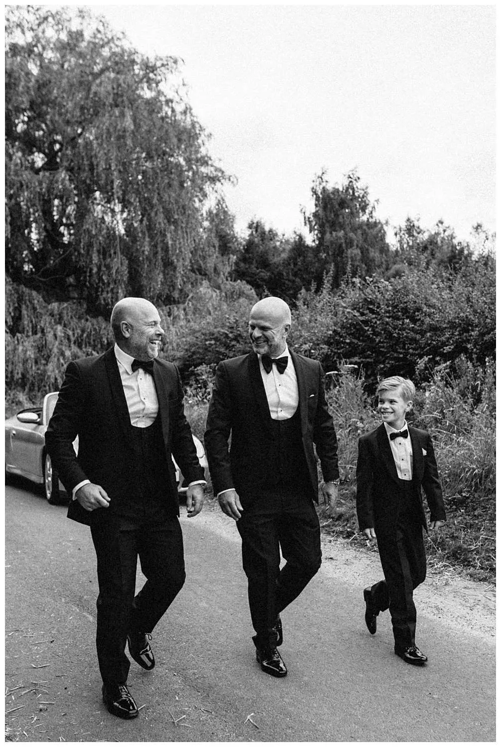 Colchester Wedding photography - Black and white image of the groomsmen laughing