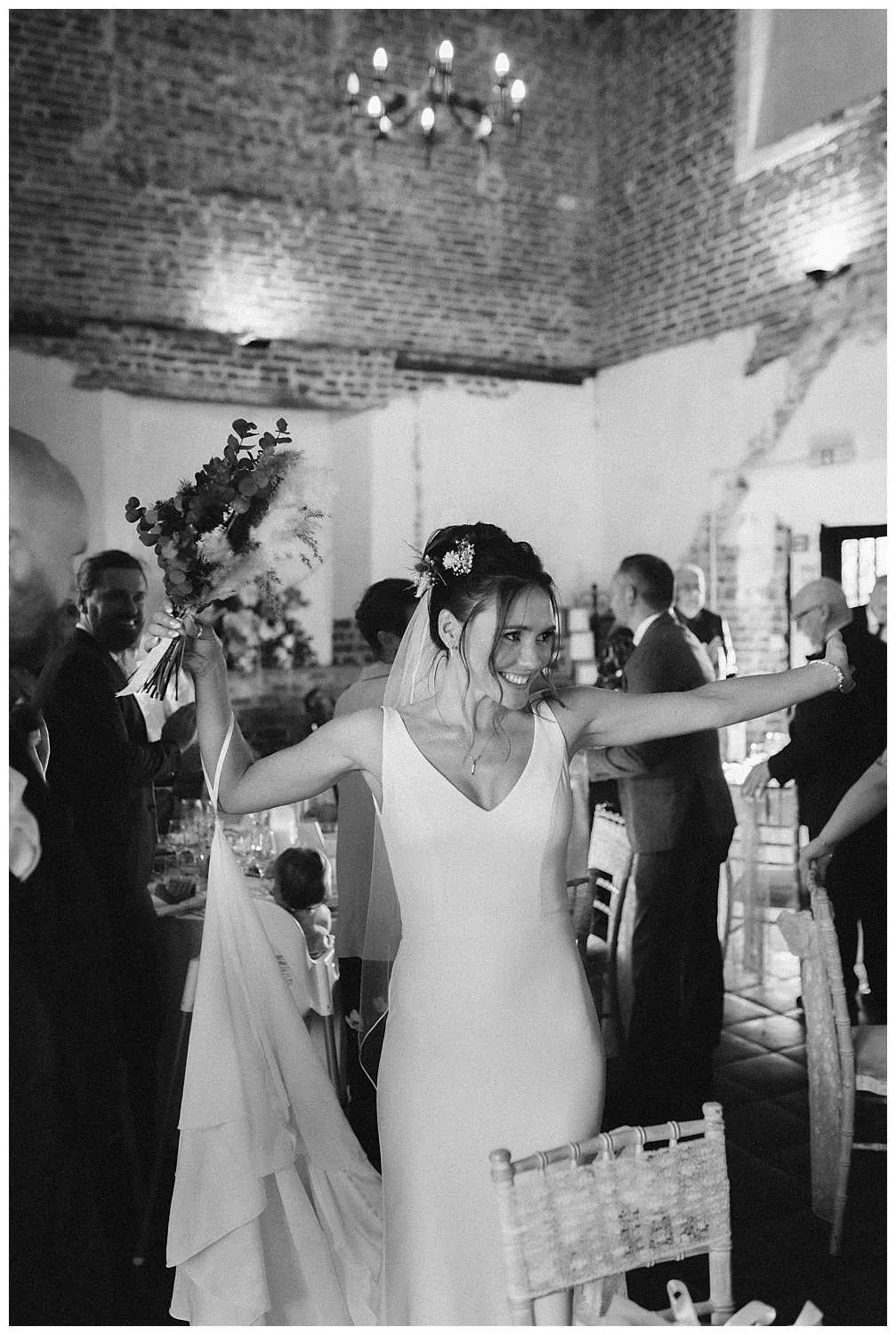 The bride and groom enter the reception room