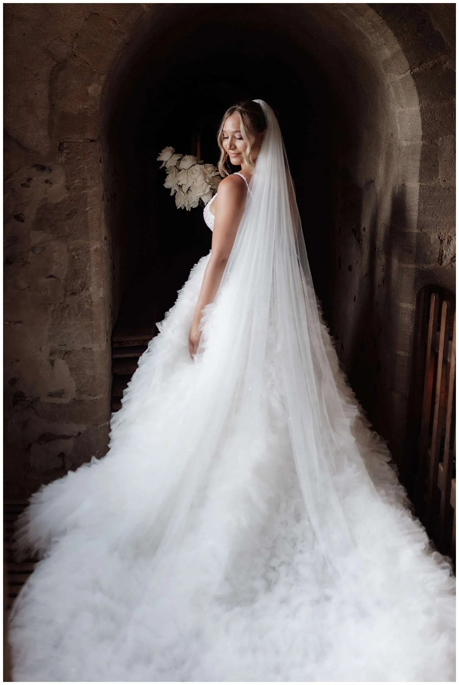 Hedingham Castle Wedding Photographer - a portrait of the bride in her wedding dress