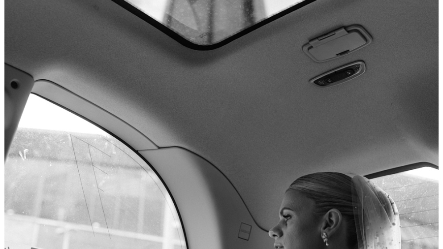 London Iconic Wedding Photography - The bride sits in a London Taxi with the Shard in the background