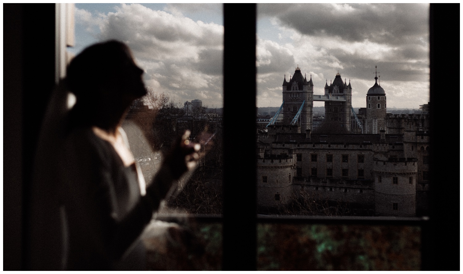 A view of London from the window as the bride puts on her perfume