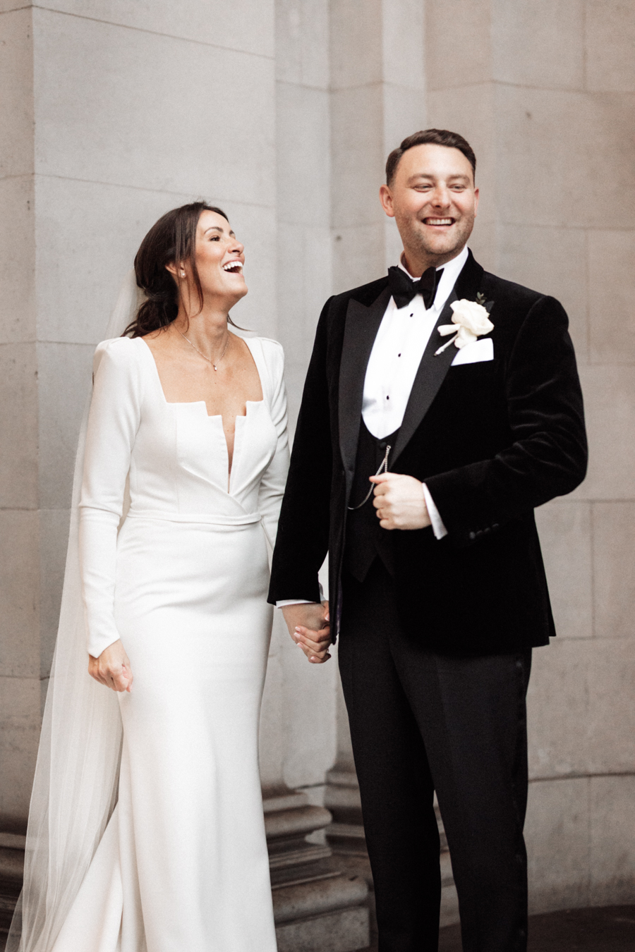 Documentary photography of a relaxed couple laughing at Marylebone Town Hall in London
