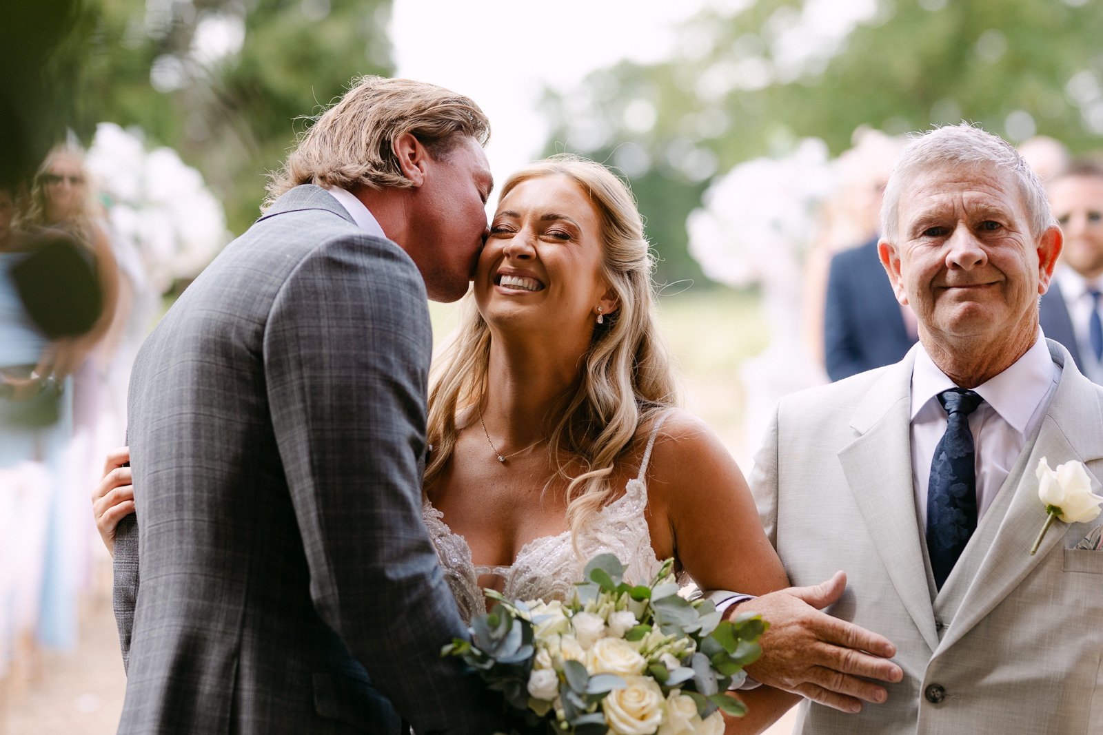 Molly and Taylor together during their outdoor wedding ceremony at Gosfield Hall