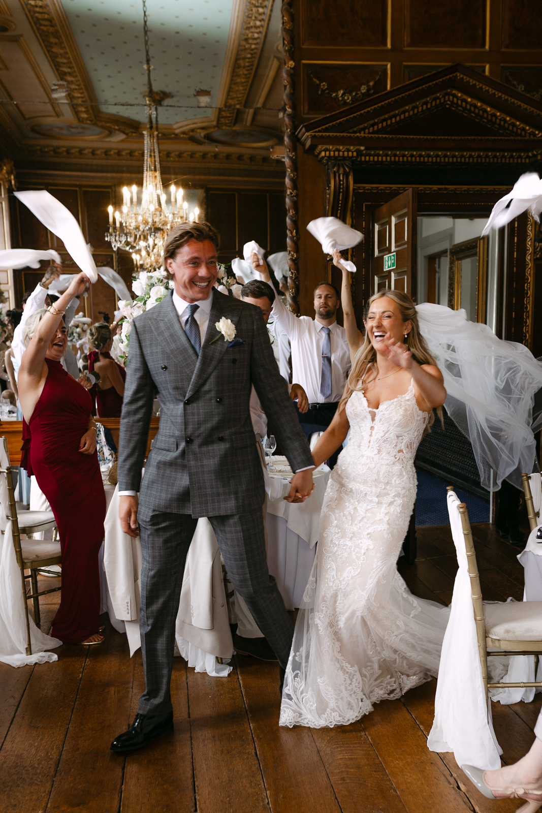Molly and Taylor making their entrance into their wedding breakfast at Gosfield Hall