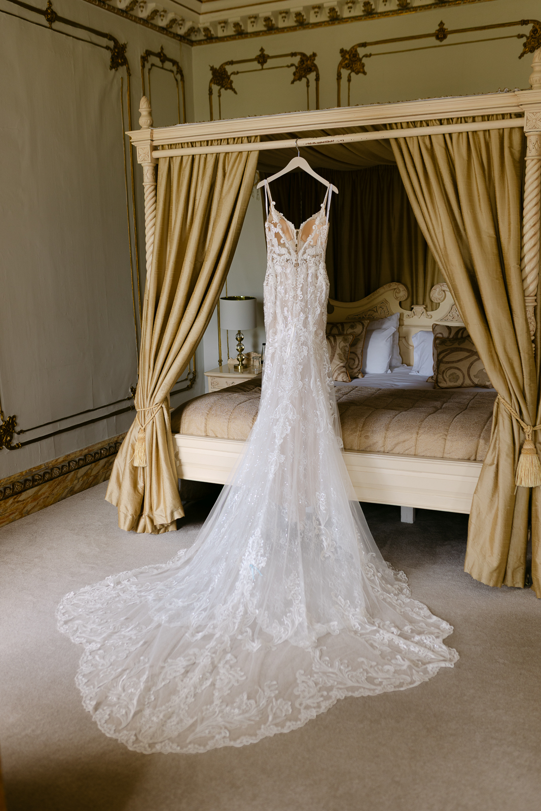 Molly's lace wedding dress hanging ready for the ceremony