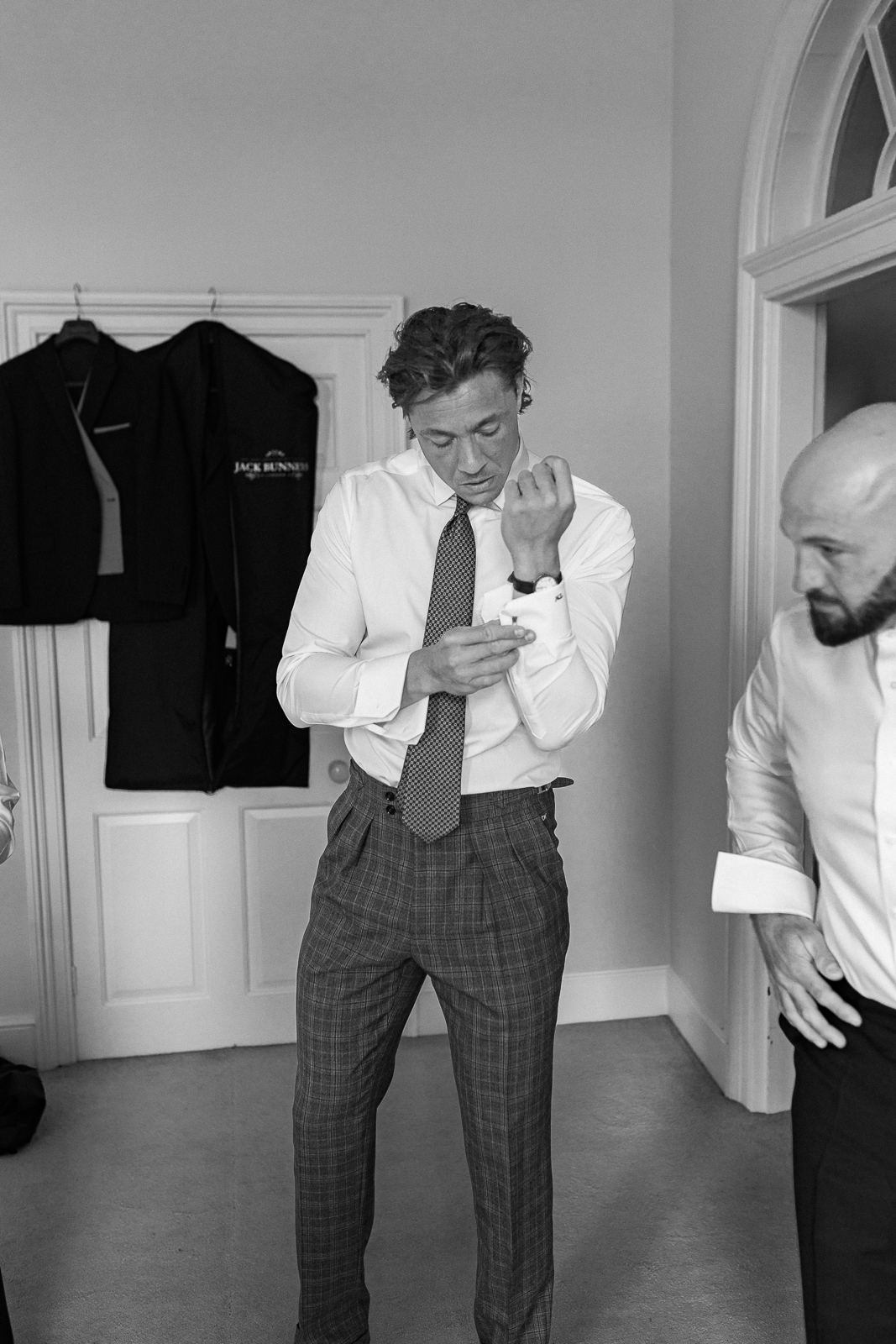 Taylor getting ready with family and friends on his wedding morning